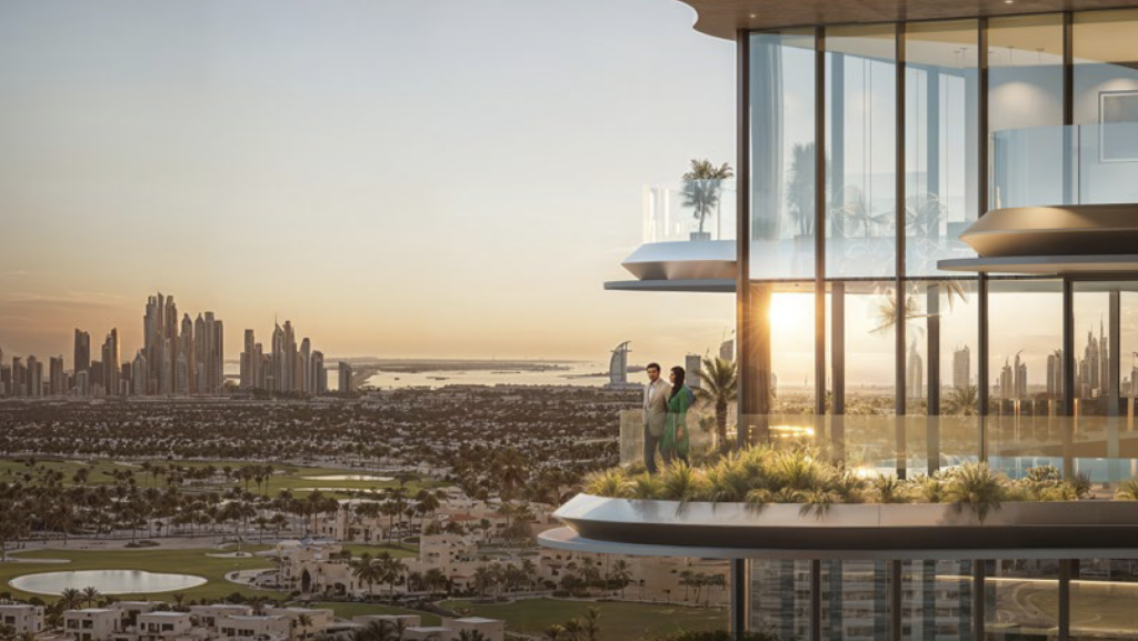A modern balcony high above the sunset with two people standing by the railing. The view from One Sky Park overlooks a lush cityscape with verdant golf courses, numerous buildings and a distant skyline with iconic skyscrapers and a body of water.