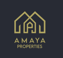 Un logo pour Amaya Properties représentant deux maisons abstraites en or sur un fond sombre. Les maisons stylisées forment un « A », avec le nom de l'entreprise « AMAYA PROPERTIES » écrit en dessous en élégantes lettres majuscules dorées.