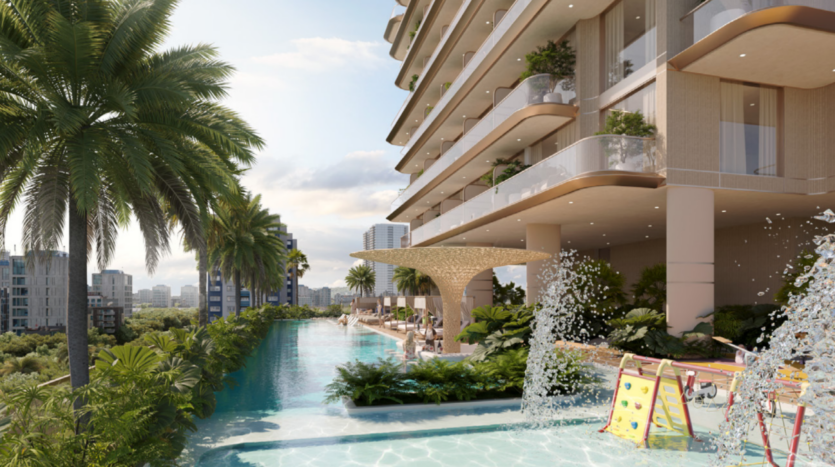 Luxueux espace piscine surélevé du One Park Square avec cascades, palmiers tropicaux et végétation luxuriante. Ce bâtiment moderne dispose de balcons spacieux sur la droite, tandis que l'horizon de la ville orne l'arrière-plan sous un ciel dégagé.