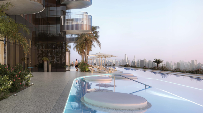 La piscine à débordement sur le toit du W Residences propose des chaises longues circulaires et une vue imprenable sur les toits de la ville. Nichée au milieu des palmiers et d'une architecture moderne, cette oasis luxueuse dans les Jumeirah Lake Towers présente une eau bleu pâle et un ciel pastel, créant un cadre tranquille incomparable.