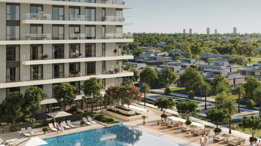 Vida Residences est un immeuble d'appartements moderne de grande hauteur avec balcons donnant sur un grand espace extérieur doté d'une piscine. En arrière-plan, des rangées de maisons de banlieue arborées s'étendent vers un horizon lointain parsemé de grands immeubles.