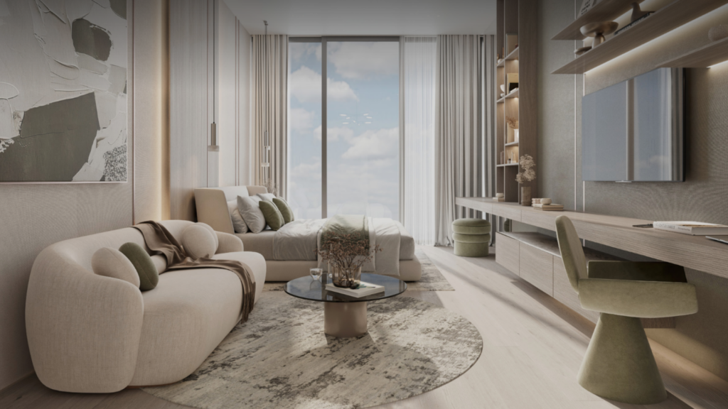 Un salon et une chambre modernes sont dotés d'un canapé beige, d'une petite table ronde et d'un lit. De grandes fenêtres offrent une vue sur le ciel. La décoration aux couleurs neutres, inspirée de Cove Edition 3, comprend des coussins, un tapis texturé et un bureau avec une chaise. Des étagères avec des objets décoratifs ornent le mur.