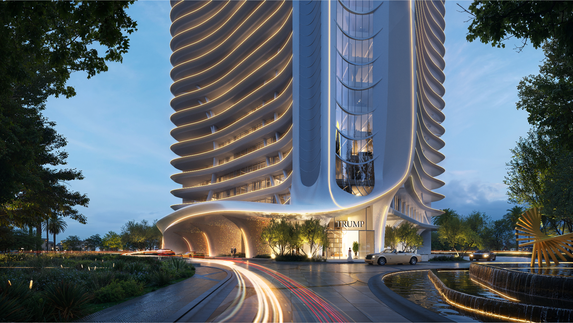 Un gratte-ciel moderne et futuriste ressemblant à la Trump Tower présente une architecture blanche incurvée, illuminée par des lumières au crépuscule. Des voitures aux phares flous circulent devant le bâtiment, entouré de verdure paysagère et d'un plan d'eau.