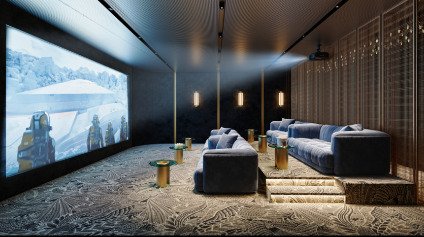 A modern home cinema with soft gray sofas facing a large screen showing a snowy scene. The room features textured wallpaper, patterned carpeting and warm mood lighting, with small round tables placed near the sofas.