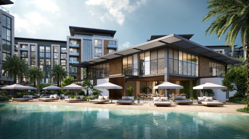 A modern luxury resort overlooking the pool. The scene includes a light-blue pool, deckchairs with white parasols and an elegant two-storey building with large picture windows. Palm trees are scattered throughout the area and the sky is partly cloudy.