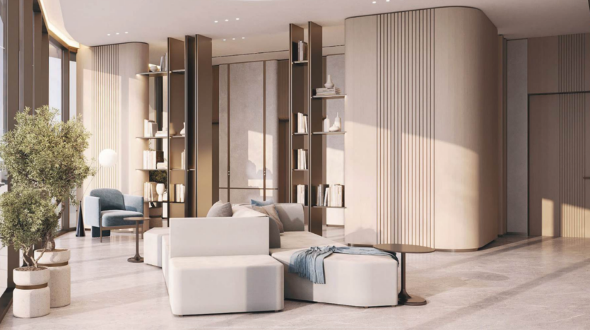 A modern, minimalist living space with natural light. Features include white modular sofas, a round table, tall shelves, a blue armchair and potted plants. The design uses soft, neutral colors and curved wooden partitions for a soothing ambience.