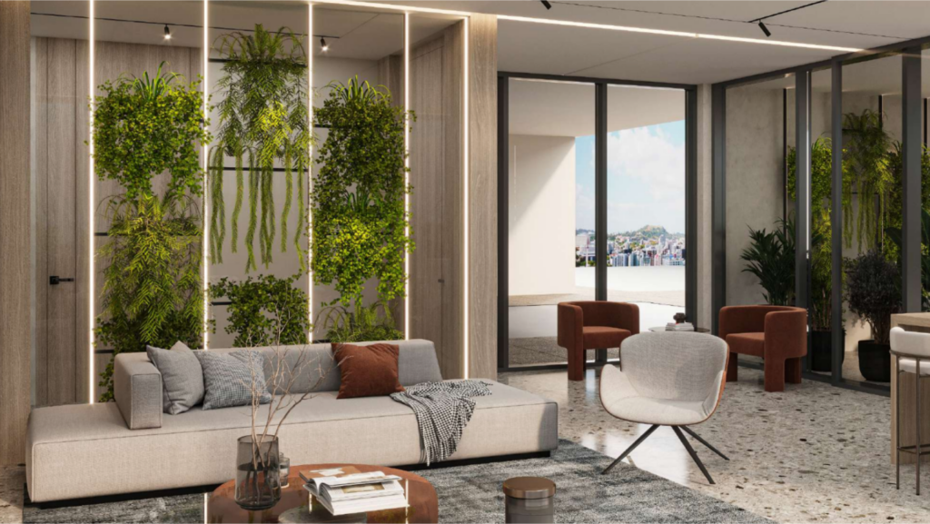 Il moderno soggiorno comprende un elegante divano con coperta, un tavolino rotondo e una sedia. I giardini verticali sono allineati alle pareti e le grandi finestre offrono una vista sul paesaggio urbano. La stanza è decorata con toni neutri.
