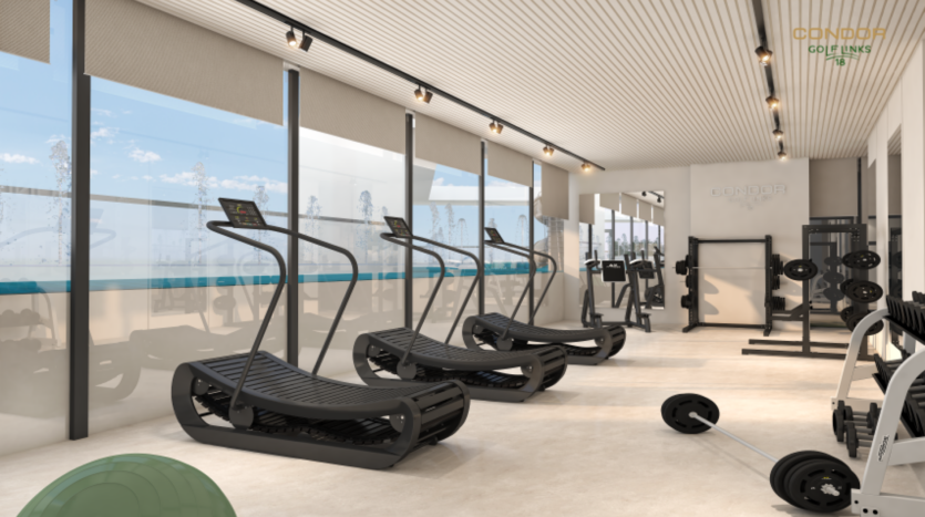 Une salle de sport moderne avec de grandes fenêtres, comprenant plusieurs tapis de course, des équipements d'haltérophilie, un ballon d'exercice vert et une barre au sol. L'espace bien éclairé est aussi vaste qu'un terrain de golf, avec des murs et un sol de couleur neutre renforçant sa sensation d'espace.