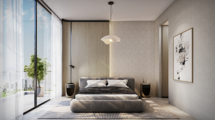 A modern Verano room with a large window offers stunning city views. It features a low bed with gray bedding, two bedside tables, a pendant lamp, abstract wall art and a textured rug. Natural light fills the room, enhancing its minimalist decor.