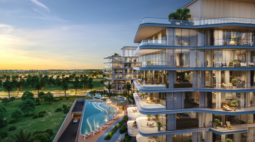A modern high-rise building with glass balconies, Verano Towers overlooks a crescent-shaped swimming pool and landscaped terrace. The setting unfolds before a sunset sky and a verdant landscape dotted with palm trees.