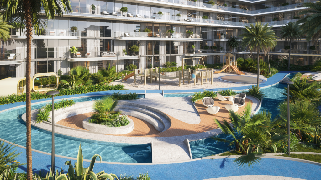 The courtyard of the Verano apartment complex features a winding pool with walkways, surrounded by tropical plants. Comfortable seating areas, a playground and multi-level balconies with glass balustrades overlook the lush landscape, creating a welcoming oasis.