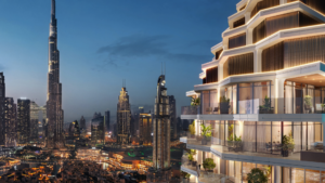 Al tramonto, il moderno paesaggio urbano di Dubai è ornato da uno skyline futuristico. L'edificio più alto è illuminato e spicca tra gli altri grattacieli. In primo piano, un edificio di lusso con terrazze e spazi verdi si affaccia sulla vivace città, riflettendo i risultati dell'UBS Bubble Index 2024.