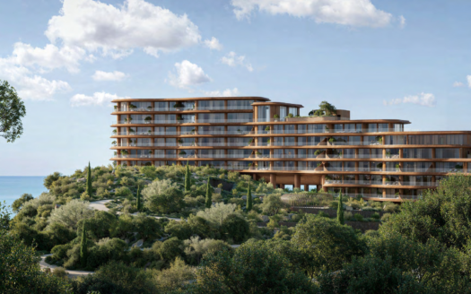 Dieses moderne Hotel in Dubai liegt an einem Hügel und verfügt über eine elegante Architektur aus Glas- und Holzpaneelen, umgeben von üppiger Vegetation. Mit Blick auf die ruhige Asora-Bucht bietet es bei teilweise bewölktem Himmel einen atemberaubenden Blick auf den Ozean.