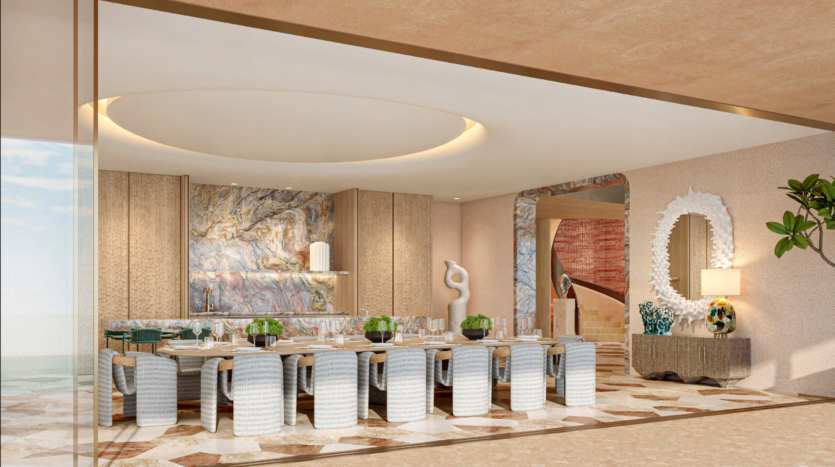 Luxurious dining room in Asora Bay, Dubai, with a large rectangular table surrounded by upholstered chairs. The room features a marble wall, a modern sculpture, a decorative mirror and a geometrically patterned rug. A soft ceiling light creates a warm ambience.
