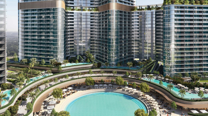Aerial view of the Skyvue modern luxury hotel complex, comprising three high-rise towers. Below, a circular swimming pool is surrounded by lush landscaping, sun loungers and parasols. The towers feature balconies and greenery on the terraces, embodying the essence of elegance and tranquility.