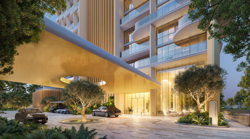 The Atelis design district features a modern entrance with an elegant curved wooden canopy. Cars are parked next to large glass doors, surrounded by lush greenery and trees. Warm lighting creates a welcoming atmosphere, while tall windows offer a glimpse of the elegant interior.