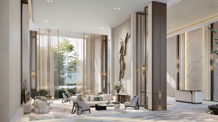 The spacious, modern lobby, inspired by the Atelis design district, features high ceilings and large windows. Contemporary furniture, abstract artwork on the walls and a mix of natural and artificial light create a warm atmosphere. Tall columns and decorative plants add a touch of elegance.