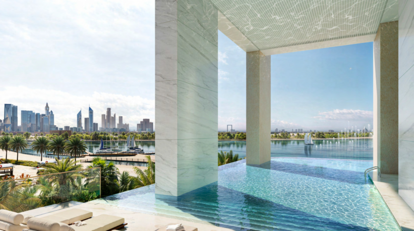 Luxurious infinity pool on the roof of the Atelis Design District, overlooking the city, its modern skyscrapers and lush vegetation. The peaceful blue sky and scattered clouds create a serene, refined atmosphere, a true urban oasis, in this dynamic location.