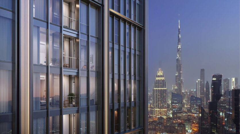 Close-up of a modern skyscraper with large windows revealing the interior and plants. In the background, the illuminated DIFC Heights stands out against the city skyline at dusk, with its imposing needle-shaped skyscraper completing the picture.