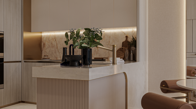 A modern kitchen with beige cabinets, marble credenza, gold faucets, decorative plants such as floarea skys and dark kitchen utensils on a light-colored worktop. The space is warm and elegant, with sophisticated minimalist design elements.