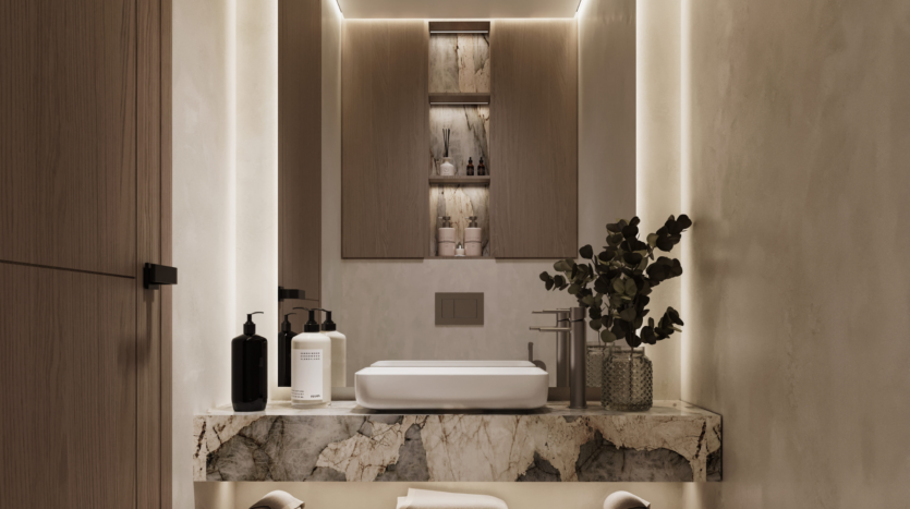 Modern bathroom with rectangular washbasin on marble worktop, minimalist fittings, toiletries and flower vase. Soft, indirect lighting highlights the wooden furniture and shelves, as well as the decorative objects above the sink.