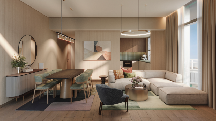 Il DoubleTree by Hilton Dubai offre una moderna zona giorno e pranzo a pianta aperta con divano angolare beige, tavolino rotondo, sedie verdi e cucina contemporanea. Le ampie finestre illuminano lo spazio e ne esaltano le eleganti tonalità neutre.