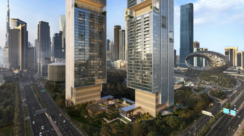Paisaje urbano compuesto por dos modernas torres rodeadas de árboles, amplias carreteras y otros rascacielos; al fondo se ve el Museo del Futuro, un futurista edificio ovalado.