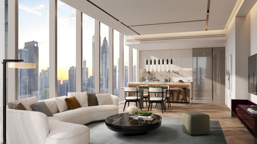 Moderno salón y cocina con ventanales que ofrecen impresionantes vistas de la ciudad. El espacio incluye un sofá blanco curvado, mesa de centro negra redonda, zona de comedor y elegante iluminación, en un espacio luminoso y contemporáneo.