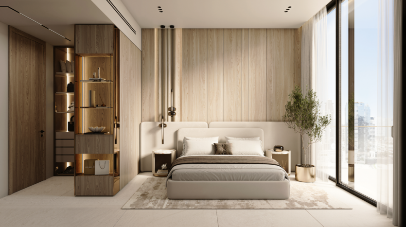 A modern, minimalist bedroom with light woodwork, a king-size bed with neutral bedding, picture windows with sheer curtains, a large potted plant and built-in shelves with decorative objects.