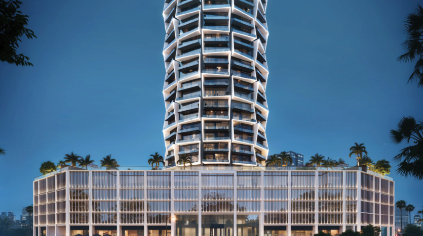 A modern high-rise with twisted architecture and illuminated edges. The lower levels have a grid façade and green roofs with palm trees, all set against a clear sky.