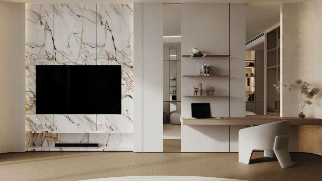 Modern living space with a marble accent wall on which a TV is mounted, built-in shelves with decoration, a minimalist desk with a laptop and a contemporary white chair; neutral tones and soft lighting.