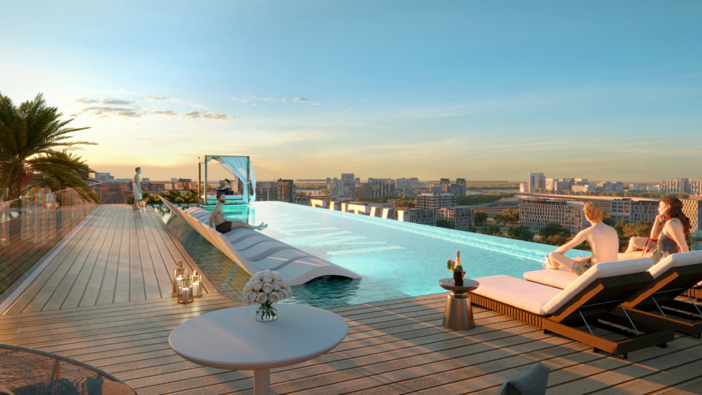 Alors que le soleil se couche sur la ville, les clients du Cove Edition 6 de Imtiaz se détendent au bord de la piscine à débordement située sur le toit. Des palmiers, des bougies et une table garnie de fleurs et de champagne créent une ambiance propice à la détente.