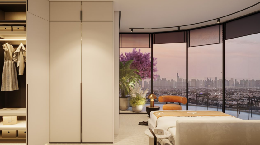 Modern bedroom with built-in wardrobe, open closet and well-made bed. Large floor-to-ceiling windows reveal the city skyline at sunset, a purple flowering tree and potted plants on the balcony. Minimalist decor throughout.