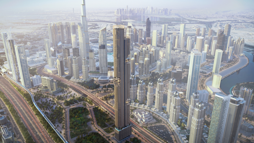 Aerial view of a modern city with numerous skyscrapers, freeways and green spaces; the tallest building stands out prominently in the middle of the dense urban landscape.