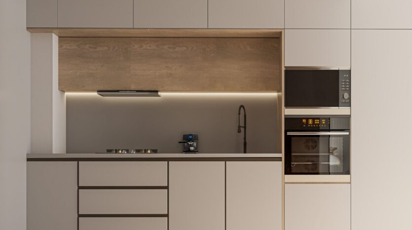 Minimalist modern kitchen with beige cabinets, built-in range, coffee machine and berkeley square prestige one wall faucet. Under-cabinet lighting and wood accents create a clean look, with a built-in oven and microwave.