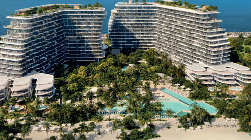 Aerial view of two modern, curved beachfront hotel buildings at Passo by Beyond Palm Jumeirah, surrounded by lush vegetation, multiple pools, palm trees, relaxation areas and a sandy beach facing the ocean in the background.