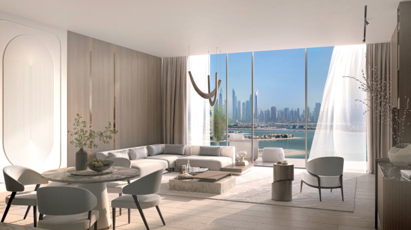 A modern, sunny lounge with neutral tones, elegant furnishings and floor-to-ceiling windows offering stunning views of the city skyline and waterfront at Passo by Beyond Palm Jumeirah under a clear blue sky.