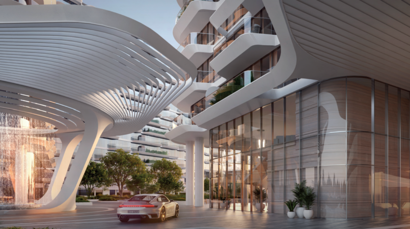 Modern glass building with curved white architectural structures, trees, a fountain and a silver sports car parked near the entrance. The scene is bright and contemporary, suggesting a luxurious setting.