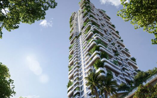 A large modern skyscraper, Talea by Beyond, with white balconies adorned with green plants and trees, seen from below against a backdrop of blue sky and framed by leafy branches.