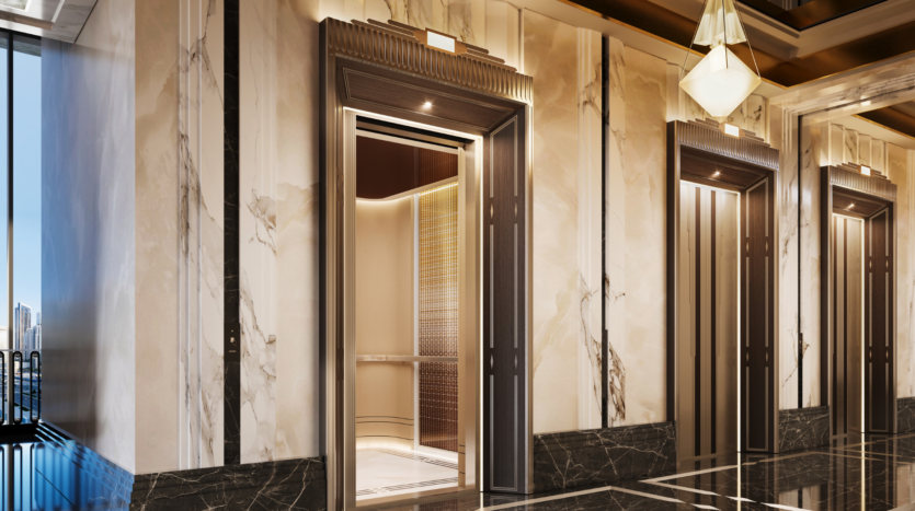 Il lussuoso corridoio di marmo del Waldorf Astoria Business Bay Dubai è caratterizzato da tre moderne porte di ascensore. Una di esse è aperta e rivela un interno elegante e ben illuminato con accenti metallici e dettagli in oro.