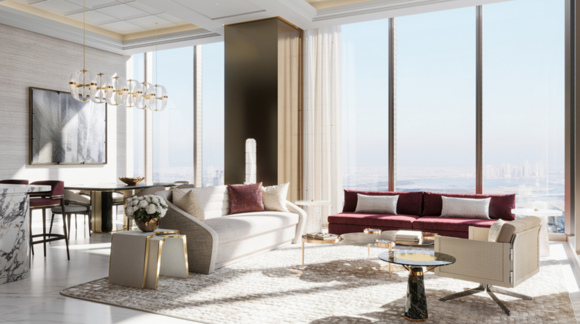 Lounge moderna ed elegante del Waldorf Astoria Business Bay Dubai con vetrate a tutta altezza, vista sulla città, divano chiaro, divano in velluto marrone, tavoli in marmo, moquette e zona pranzo con lampadario scultoreo e opere d'arte.