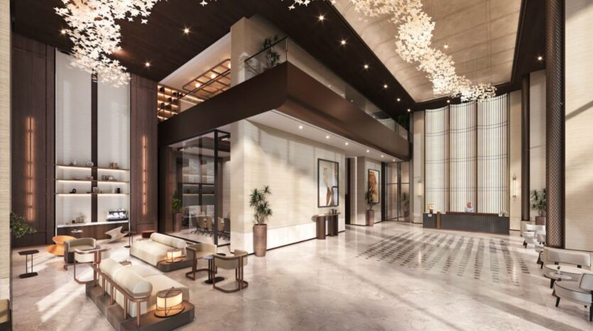 The Marquis One Arjan Hotel's modern lobby, with its high ceilings, elegant seating, marble floors, decorative murals, lush plants and sculptural pendant lighting, includes a reception area and mezzanine.