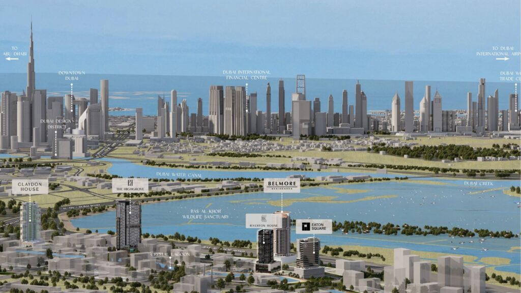 Aerial view of the Dubai skyline, with landmarks, skyscrapers, Ellington Properties' Riverton House, waterways and residential buildings in the foreground, against a backdrop of blue skies and the Arabian Gulf.