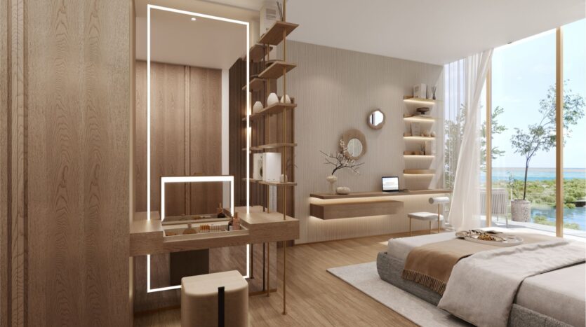 Chambre à coucher minimaliste avec des tons de bois naturel, des étagères encastrées, un bureau avec un ordinateur portable et un lit avec des draps beiges. Les fenêtres du sol au plafond du wynwood horizon de Imtiaz offrent une vue pittoresque sur les arbres et l'eau à l'extérieur.