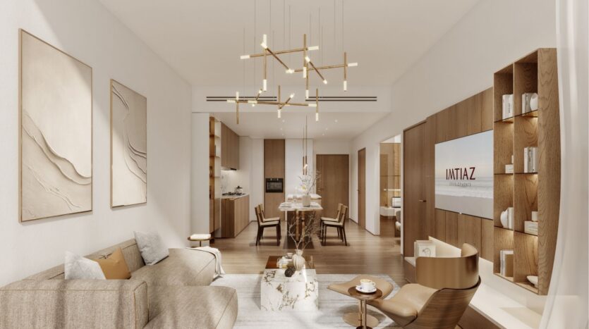 Salon et salle à manger modernes à Wynwood Horizon de Imtiaz avec des tons neutres, des meubles en bois, de l'art mural abstrait, un canapé beige, une télévision sur un panneau en bois et des luminaires suspendus contemporains. L'espace est lumineux, élégant et accueillant.