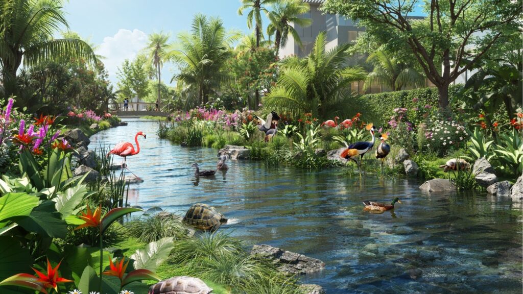 A lush tropical garden with a pond surrounded by brilliant flowers, palms, flamingos, cranes, turtles and ducks. Sunlight filters through the trees, with a house and footbridge in the background, reminiscent of the serene beauty of DAMAC Islands 2.