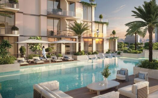 Este complejo de modernos pisos con balcones da a una lujosa piscina exterior rodeada de tumbonas, sombrillas, palmeras y vegetación. Al ponerse el sol, la gente se relaja y se sienta junto al agua.