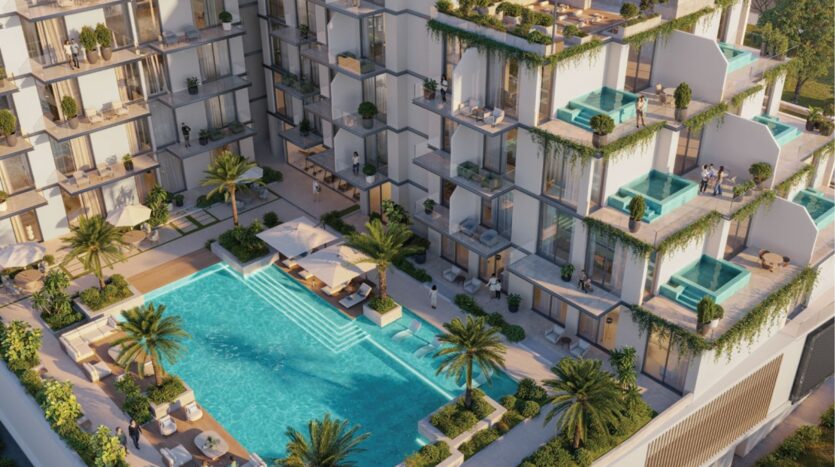 Un complexe d'appartements modernes avec balcons privés, piscines sur le toit et verdure luxuriante donne sur une grande piscine rectangulaire entourée de palmiers, de chaises longues et de sièges en plein air.