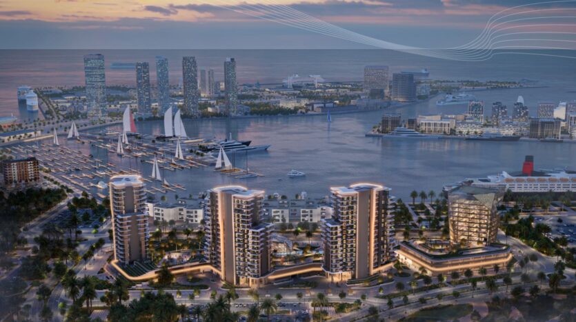 Paysage urbain au bord de l'eau au coucher du soleil, avec des gratte-ciel modernes, le port de plaisance de Mina Rashid avec ses voiliers et ses yachts, et des rues bordées de palmiers au premier plan, surplombant la mer et une ligne d'horizon lointaine.