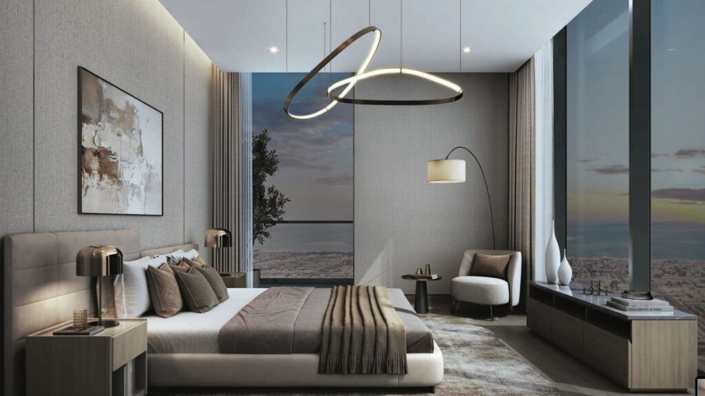 Modern bedroom with large floor-to-ceiling windows, a bed with brown and beige bedding, stylish hanging lamps, a chaise longue with floor lamp, abstract wall art and a stunning view of the SkyParks city sunset outside.